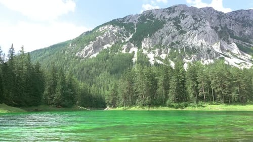 Forest Lake in the Mountains and Shadows from the Clouds