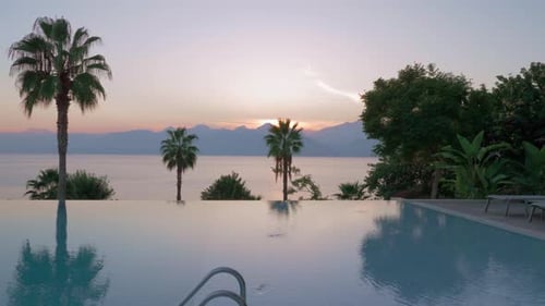 Outdoor Swimming Pool on Resort Near the Sea, Scene at Sunset