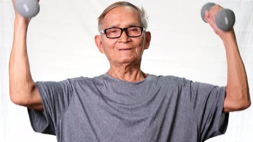 Senior Man Lifts Weights for Exercise and Fitness