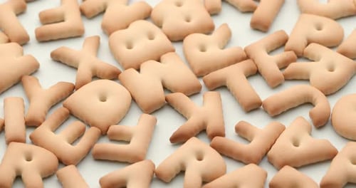 Letter Shaped Crackers On White Surface
