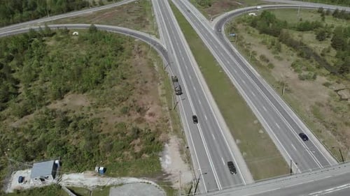 Military Vehicles Are on the Side of the Road in Front of the Bridge. Aerial View
