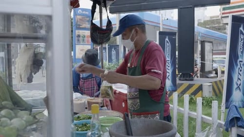 Food Vendor Preparing Take Away Food Medium Shot