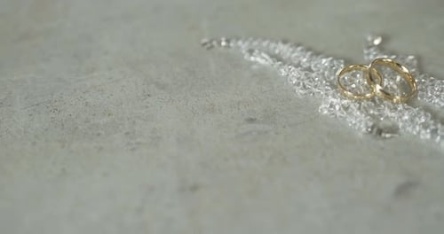 Golden Wedding Rings with Pearl Necklace, Close Up