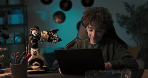 Smiling Boy with Curly Hair Spends Time Playing with Toy Assembles Robot Child Develops Passion for