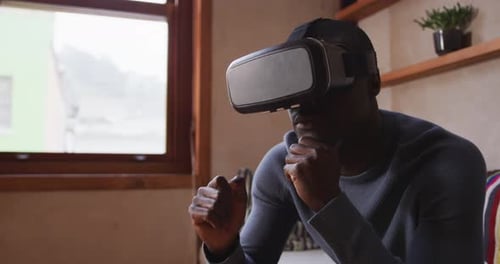 Man Using Virtual Reality Headset Indoors