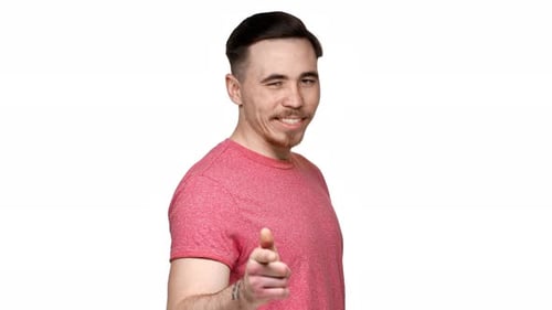 Smiling Man Points Directly at the Camera