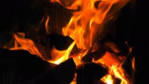 Burning Flames in Fireplace at Night