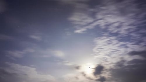 Night Time Lapse of Starry Sky and Clouds