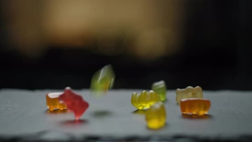 Gummy Candies Dropping on Table Close Up