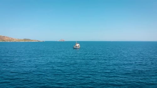 A Small Fishing Boat Goes To the Open Sea To Search for and Catch Salmon.