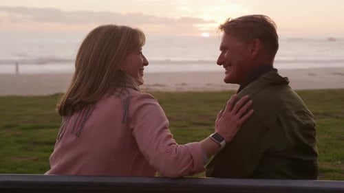 Happy Couple Enjoying the Sunset on Beach