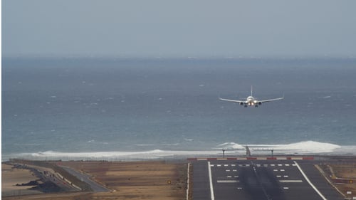 The Plane is Landing at the Airport