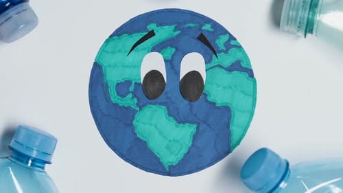 Botella de plástico descartando en la imagen del planeta Tierra, concepto de contaminación ambiental