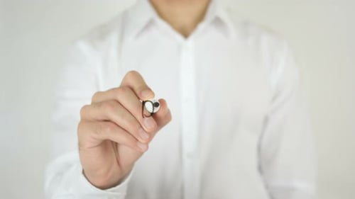 Hand Writes the Word Design on Clear Surface