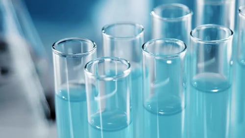 Liquid Being Dropped into Test Tubes