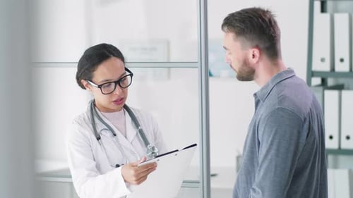 Doctor Discussing Test Results with Male Patient