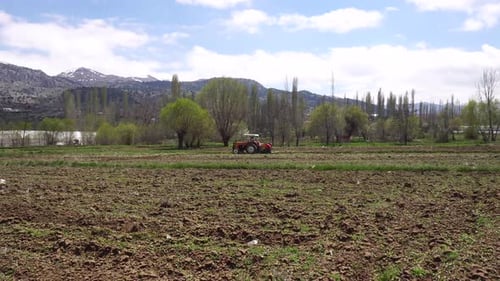 Tractor Plows Farm Land