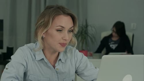 Woman Talks on Video Call in Office