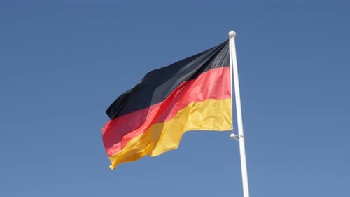 Famous Germany national symbol waving in front of blue sky 4K 2160p 30fps UHD footage - Recognizable