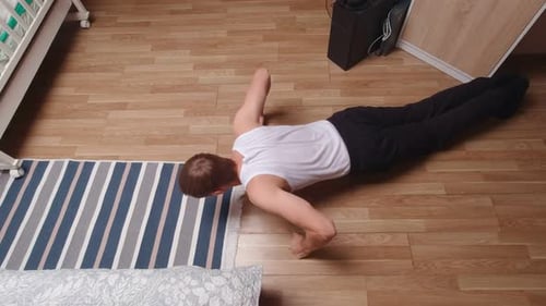 Man Exercising At Home Top View
