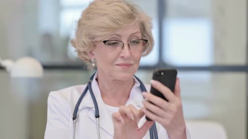 Woman Doctor Uses Smartphone
