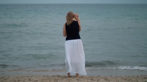 Mum with Baby Staring at the Sea
