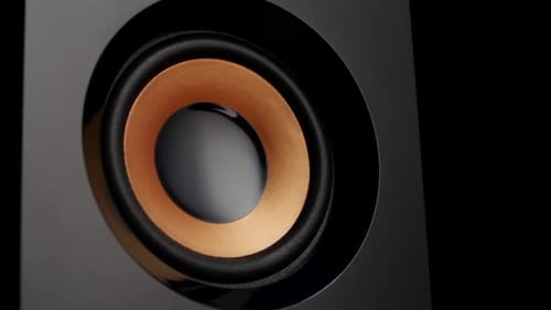 Close Up of Black and Copper Colored Speaker