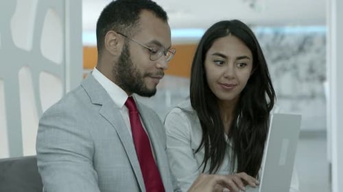 Business Meeting With Laptop in Modern Office Setting