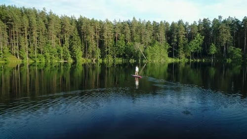 Adventurer Woman Rowing Stand Up Paddle Board