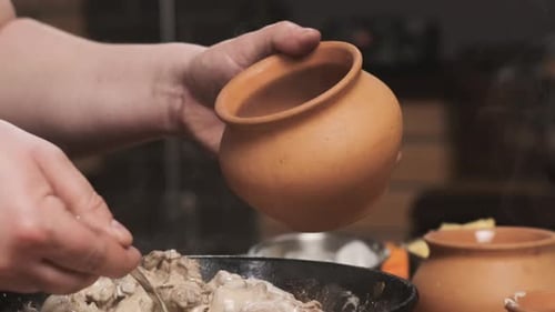 Cook Puts Liver in Sour Cream in Clay Pot for Baking Food