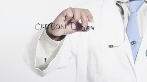 Asian Doctor Writes Carbon Dioxide