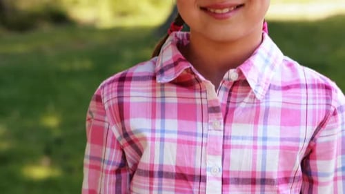 Portrait of a smiling girl in park