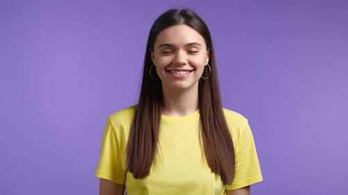 Smiling Young Woman in Yellow Shirt Close Up
