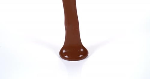 Chocolate Flowing on White Background, Slow Motion 4K