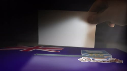 Hand Casting Vote into Falkland Islands Ballot Box