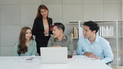 Young Adults Collaborate at Modern Office Meeting