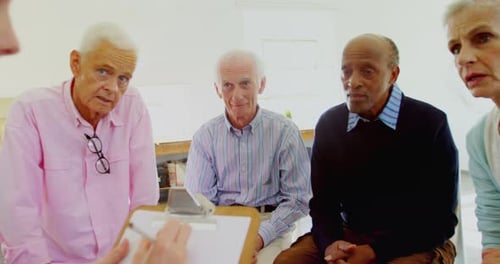 Group Therapy Session with Mature Adults Indoors
