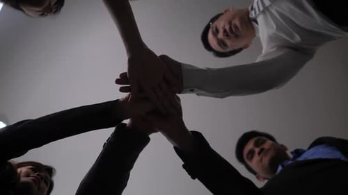 Team Puts Hands Together In Unity Celebration