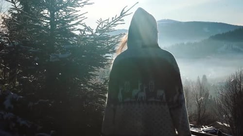Woman in Warm Jacket Walking Among Snowy Forest