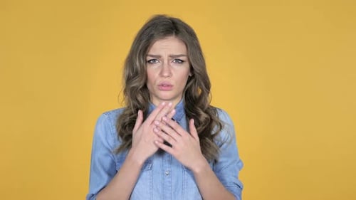 Distressed Young Woman Gasps in a Mid Shot