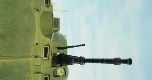Military Armored Vehicle with Machine Gun on Clear Day