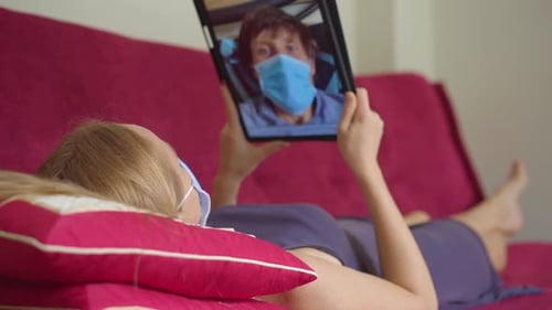 A Young Woman Talks Through Video Conferencing While She Is Staying at Home During the Coronavirus