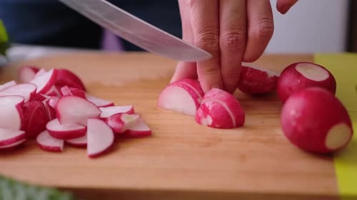 Radishes Being Sliced on Cutting Board Close Up