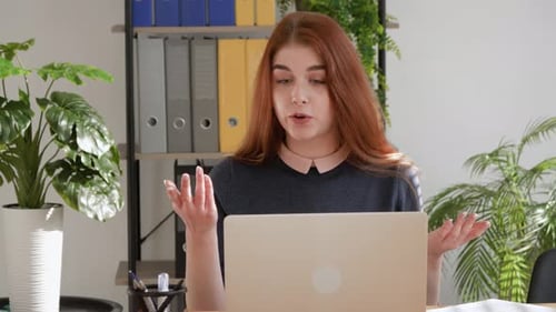 Woman Participating in a Lively Video Conference Call
