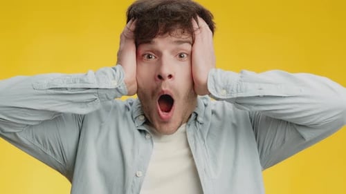 Man Reacts in Shock and Amazement