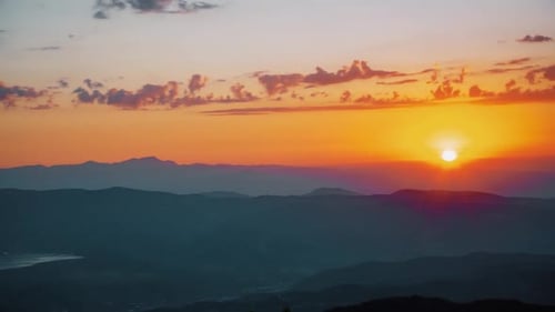 Vibrant Sunrise Over a Majestic Mountain Range