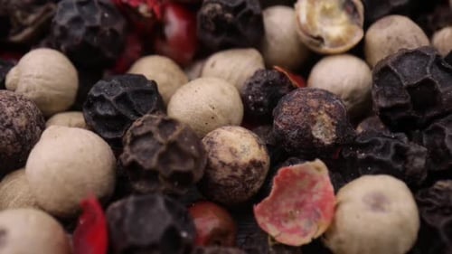 Assorted Peppercorns on Rustic Wood, Close Up