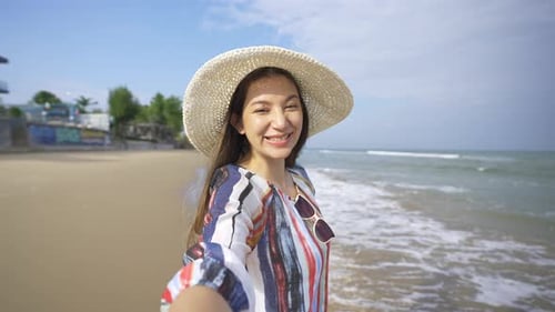 4K Portrait of Beautiful Caucasian woman walking on tropical beach in summer sunny day