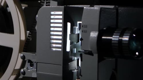 Movie Projector That Turns the Film Reel. Side View