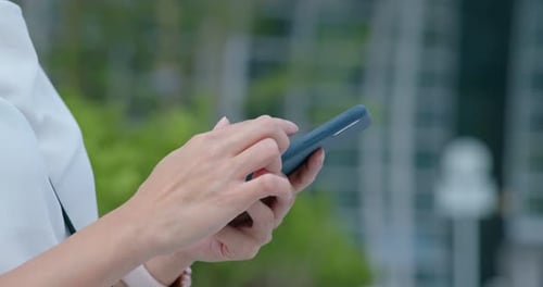 Woman Using Smart Phone in City Close Up